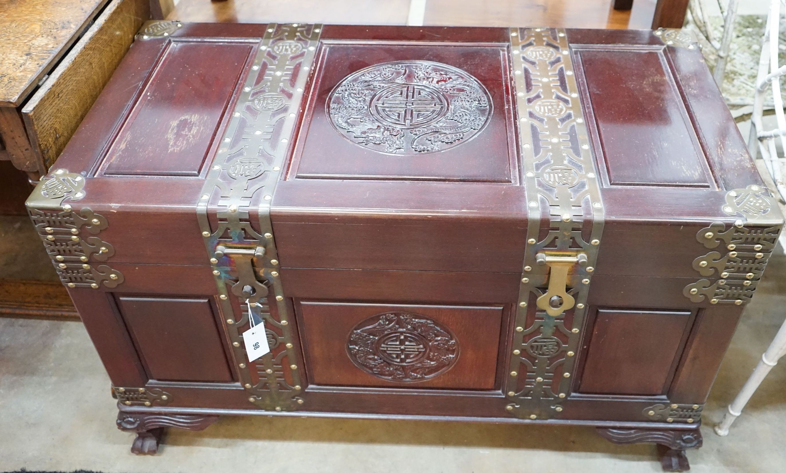 A Chinese brass mounted carved hardwood coffer, length 102cm, depth 52cm, height 63cm